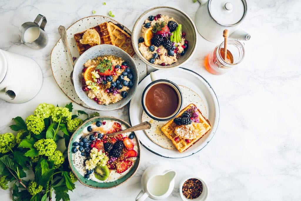 a meal on a table with lots of different bowls